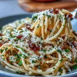 Golden al dente noodles tossed in fragrant garlic butter, ready to serve.