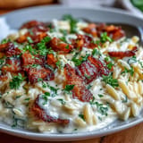 Silky Orzo Carbonara style pasta featuring rich egg sauce, perfectly cooked.
