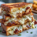 Golden brown BBQ chicken grilled cheese, warm and gooey, perfect for a hearty lunch.