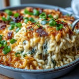 Baked Carbonara Buldak Ramen with crispy pancetta and melted mozzarella topping.